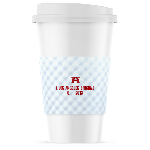 A white coffee cup with a white lid and a light blue textured sleeve featuring a red 'A' logo and the text 'A LOS ANGELES ORIGINAL C. 2013'.