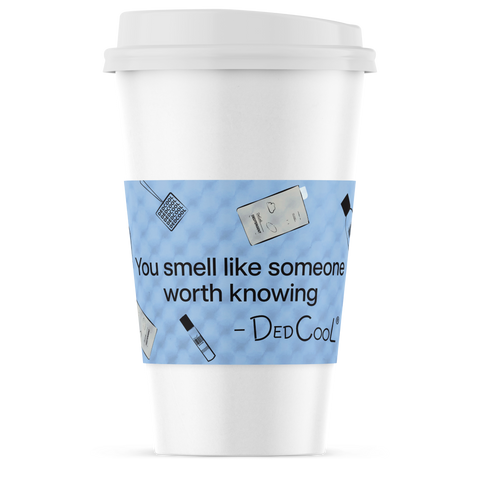 White coffee cup with a blue decorative label featuring text and small icons on a white background